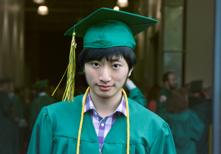 Yanwei Yang in Green River cap and gown.