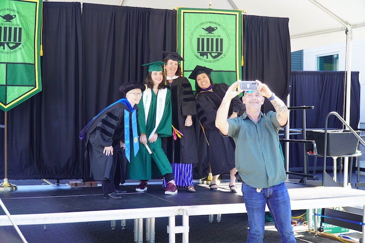 Father taking selfie with graduate