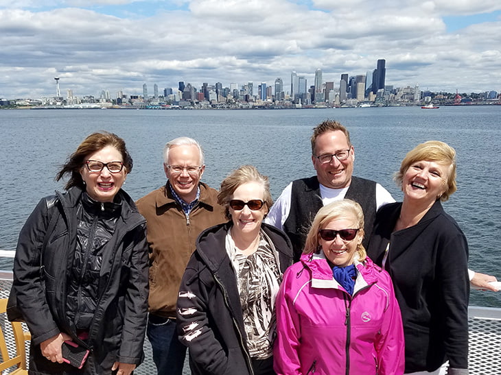 photo of Prime Time members in front of the Seattle, Washington, city skyline