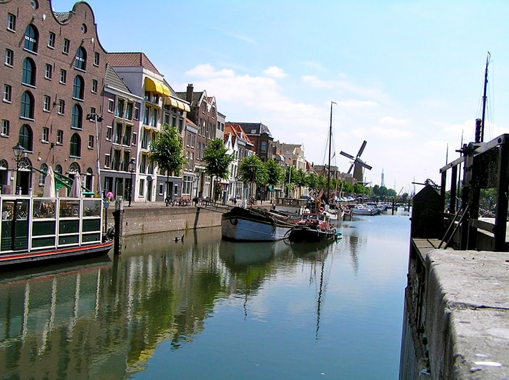 photo of a waterway with boats and buildings