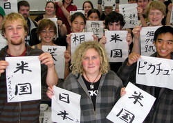 Students holding calligraphy