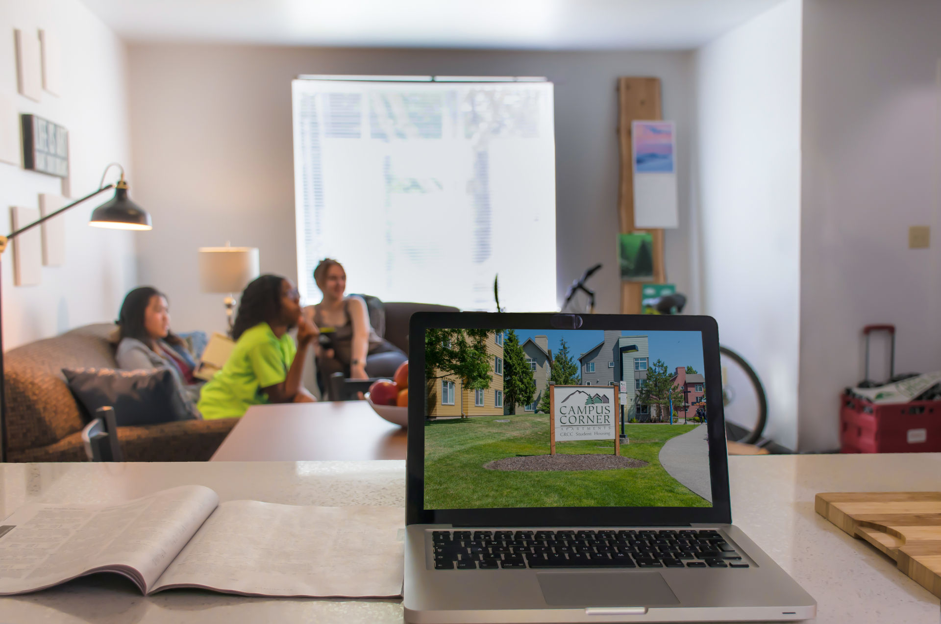 People sitting inside of a Campus Corner Apartments unit