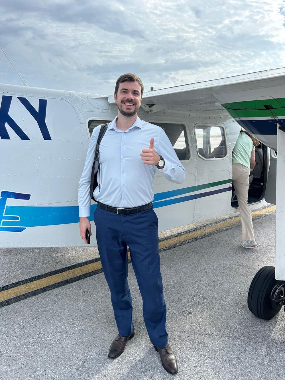 Haike Pijs at work standing infront of private jet