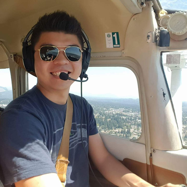 Photo of Gavin Wee piloting an aircraft