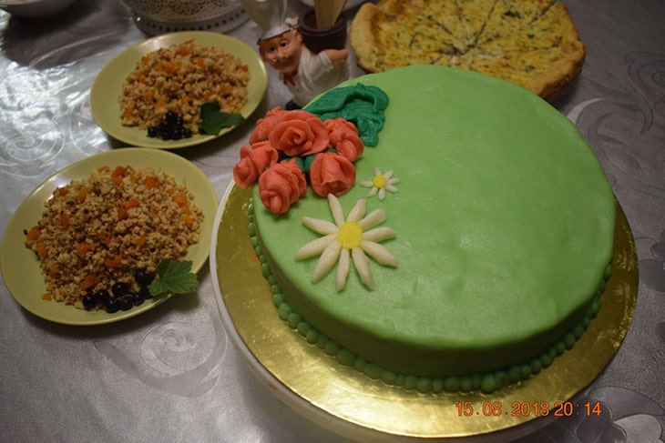 A completed cake and other baked goods.