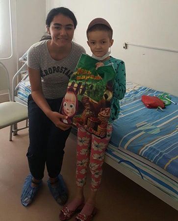 Aziza with a child hospital patient. 