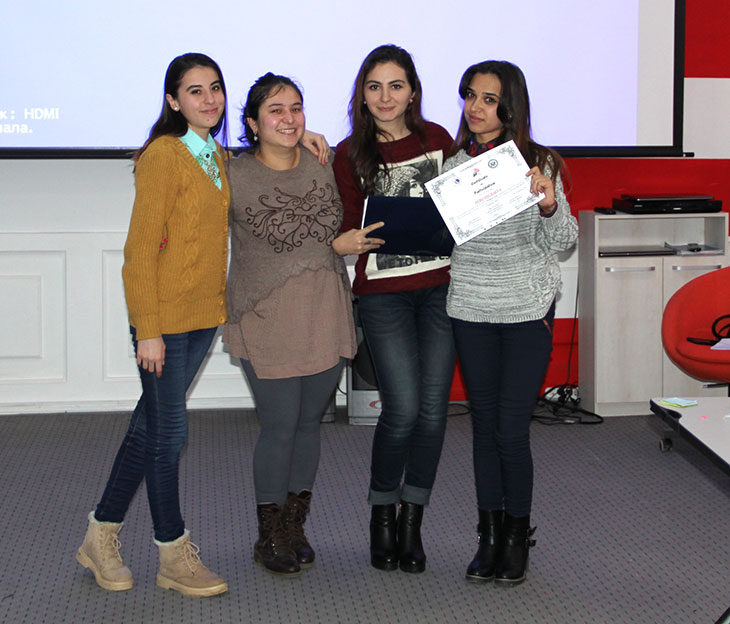 Photo of SUSI alumni Nigina, Takhmina, Zarrina plus guest speaker after implementing a two-day workshop in the capital city of Dushanbe called “Women’s Voice.”