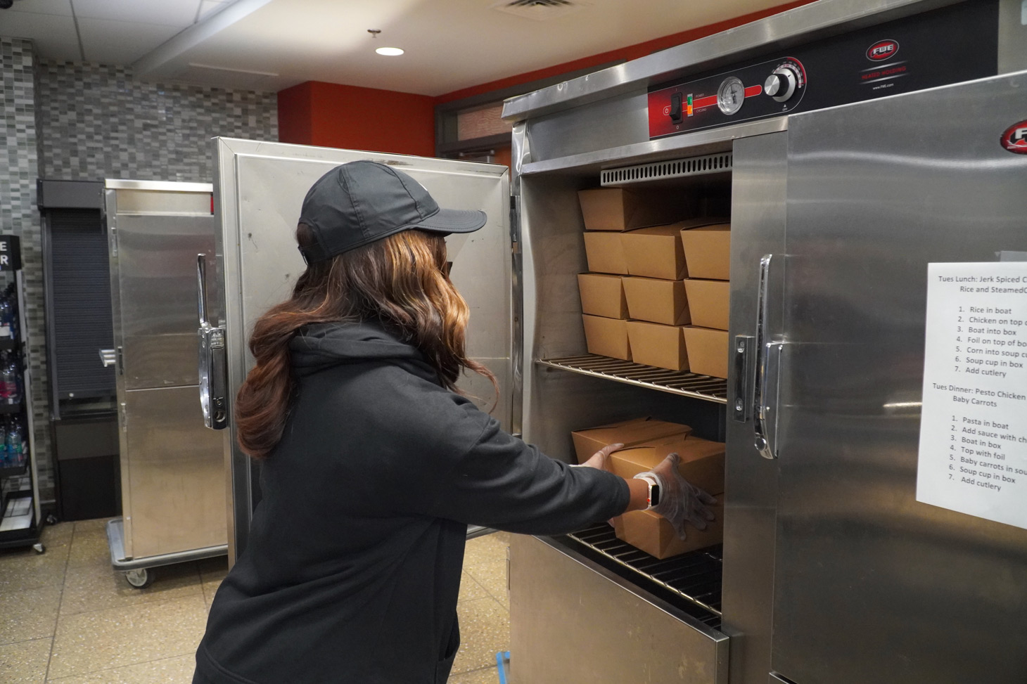 Basha Alexander places completed meals in a warming box