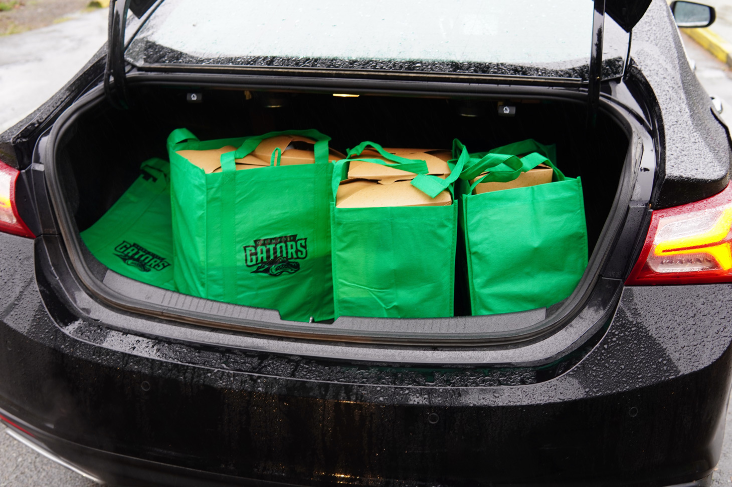 A DoorDash driver's trunk is full of completed meals