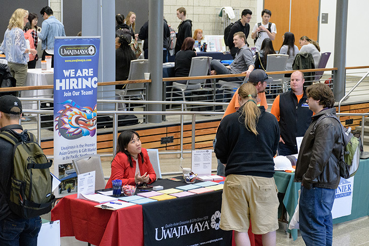 Photo of students interacting with potential employers at the 2018 Career Fair