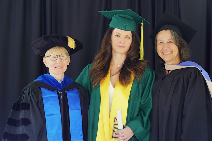 Graduate posed with Dr. Johnson and Lisa Finnsson