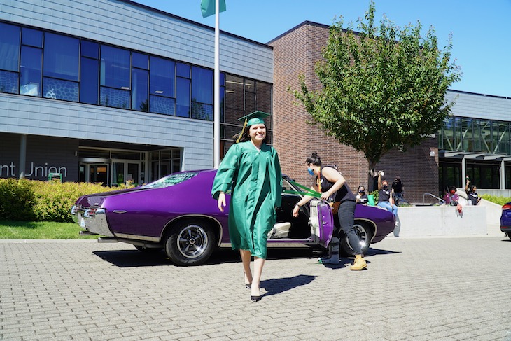 Graduate gets out of car
